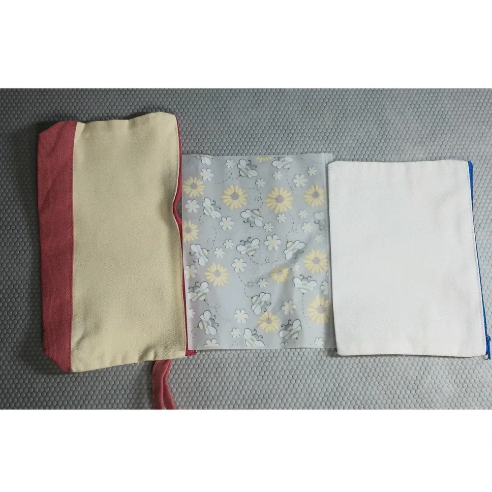 3 make-up bags ( 1- canvas w/strap and mickey head, 1 clear w/ bees & 1 canvas)